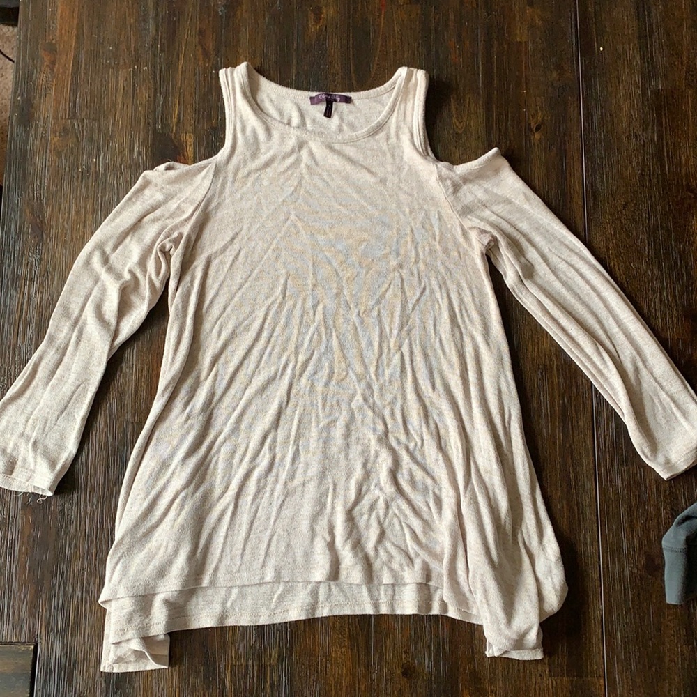 Medium open shoulder long sleeve shirt.